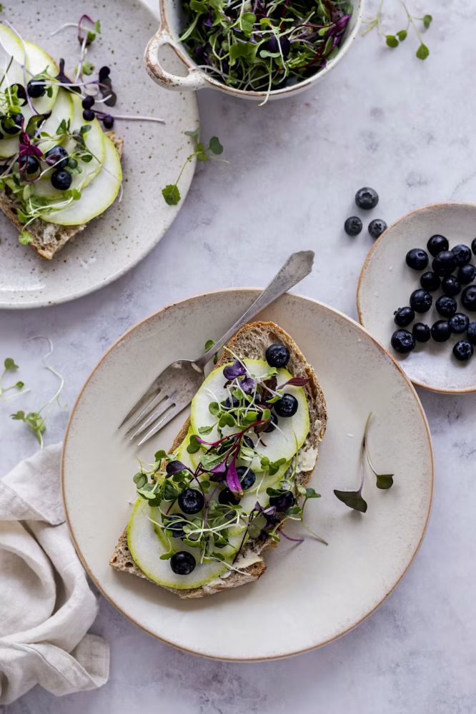 A finished plate of open sandwiches photographed from above